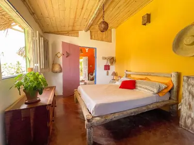 Uma cama ou camas num quarto em Casa Temática Icaraizinho