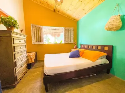 Uma cama ou camas num quarto em Casa Temática Icaraizinho