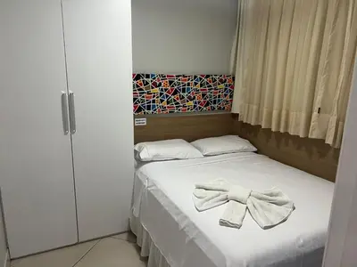 Uma cama ou camas num quarto em LANDSCAPE - Apartamento Mobiliado na Beira Mar