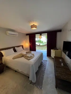 Uma cama ou camas num quarto em Beco do Mar Cumbuco
