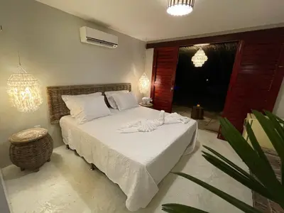 Uma cama ou camas num quarto em Beco do Mar Cumbuco