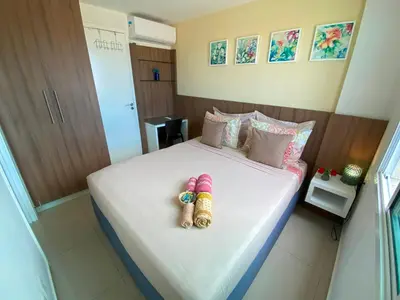 Uma cama ou camas num quarto em VG FUN varanda para o mar