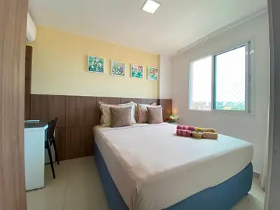 Uma cama ou camas num quarto em VG FUN varanda para o mar