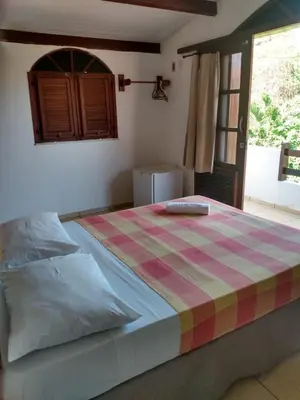 Uma cama ou camas num quarto em Paracuru Kite Village