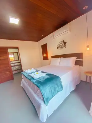 Uma cama ou camas num quarto em UMAMI RESIDENCE