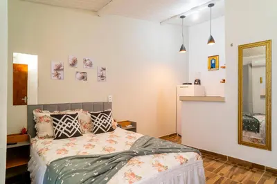 Uma cama ou camas num quarto em Vila Davi Jeri - Flats e Casa