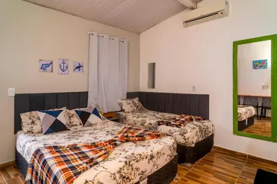 Uma cama ou camas num quarto em Vila Davi Jeri - Flats e Casa