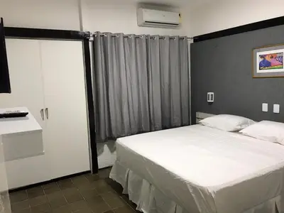 Uma cama ou camas num quarto em 401 Lindo Flat mobiliado Praia de Iracema
