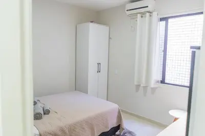 Uma cama ou camas num quarto em Apartamento BEIRA MAR