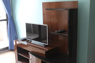 Uma televisão e/ou sistema de entretenimento em Porto de Iracema Beach Apartamentos