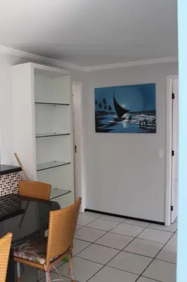 Uma televisão e/ou sistema de entretenimento em Porto de Iracema Beach Apartamentos