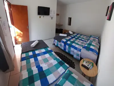 Uma cama ou camas num quarto em Hospedaria da Praia Fortaleza