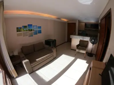 Uma área de estar em [Kariri 215] 46m², pé na areia, varanda vista mar!