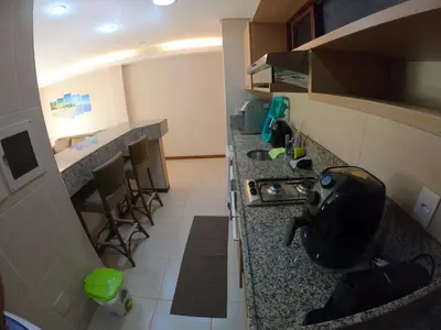 A cozinha ou kitchenette de [Kariri 215] 46m², pé na areia, varanda vista mar!