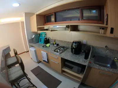 A cozinha ou kitchenette de [Kariri 215] 46m², pé na areia, varanda vista mar!