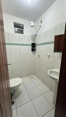 Uma casa de banho em Residência Tatiane canoa