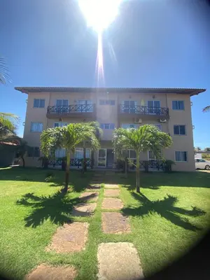 Um jardim no exterior de Lindo Flat Na Paradisíaca Praia da Taíba
