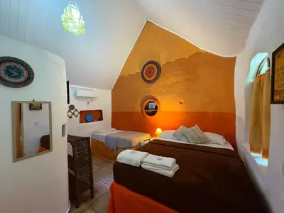 Uma cama ou camas num quarto em Pousada JeriMagia