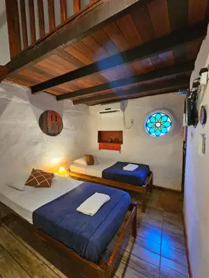 Uma cama ou camas num quarto em Pousada JeriMagia