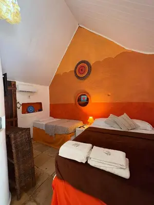Uma cama ou camas num quarto em Pousada JeriMagia