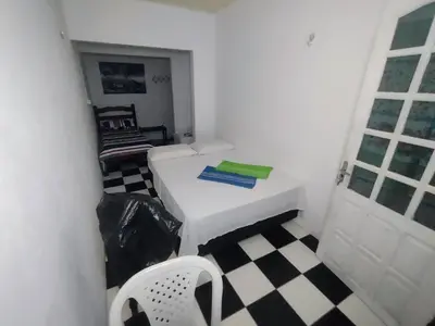 Uma cama ou camas num quarto em Pousada Casa da Perla