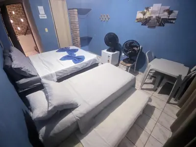 Uma cama ou camas num quarto em Pousada Casa da Perla