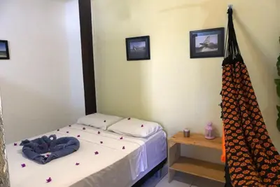Uma cama ou camas num quarto em Benu Suítes