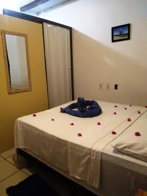 Uma cama ou camas num quarto em Benu Suítes