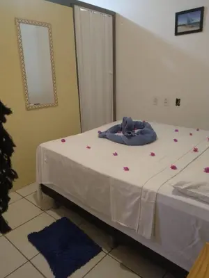 Uma cama ou camas num quarto em Benu Suítes