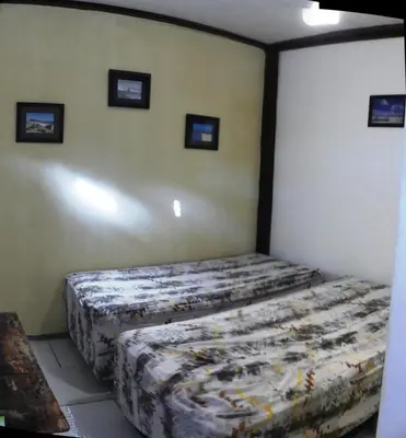 Uma cama ou camas num quarto em Benu Suítes