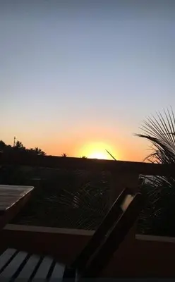 O nascer ou o pôr do sol visto a partir do hostel