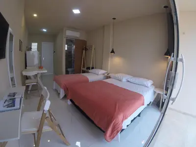 Uma cama ou camas num quarto em Flats Taiba Praia Centro