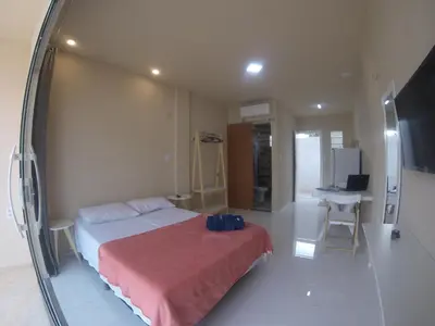 Uma cama ou camas num quarto em Flats Taiba Praia Centro