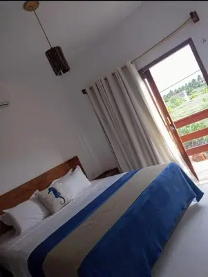 Uma cama ou camas num quarto em Villa Água de Côco Preá