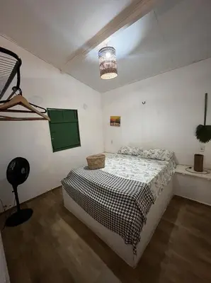 Uma cama ou camas num quarto em Pousada Vila Matury