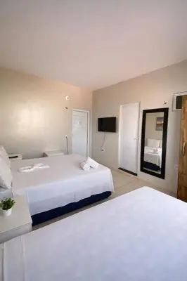 Uma cama ou camas num quarto em Praieiro pousada