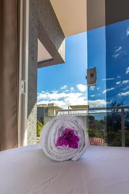 Uma cama ou camas num quarto em Praieiro pousada