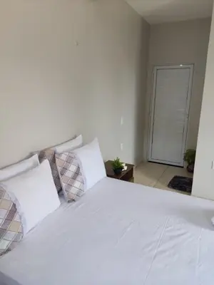 Uma cama ou camas num quarto em Praieiro pousada