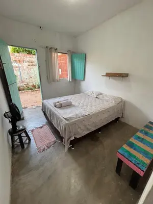 Uma cama ou camas num quarto em Hostel Flor da Vida
