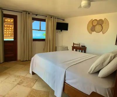 Uma cama ou camas num quarto em Pousada Borboleta