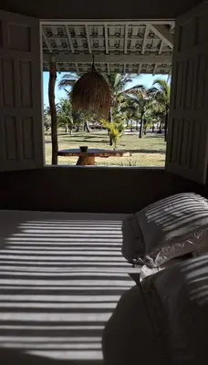 Uma cama ou camas num quarto em KANAHA BEACH VILLA
