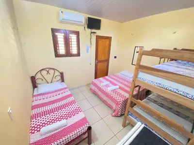 Uma cama ou camas num quarto em Pousada do Ary