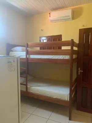 Uma cama ou camas num quarto em Pousada do Ary