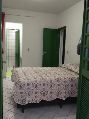 Uma cama ou camas num quarto em Porto Canoa Vista Encantadora do Mar - Thassos 101, Aracati-CE