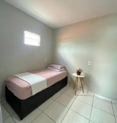 Uma cama ou camas num quarto em Teto Hospedagens