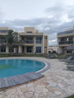 A piscina em ou perto de VILAS NA PRAIA RESIDENCE O PARAÍSO É AQUI