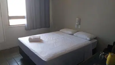 Uma cama ou camas num quarto em 805 Flat mobiliado Praia de Iracema