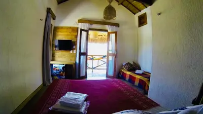 Uma cama ou camas num quarto em Pousada Rosa dos Ventos Lagoinha