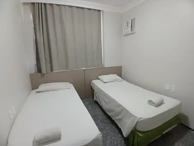 Uma cama ou camas num quarto em Saint Martin By Escala Imóveis