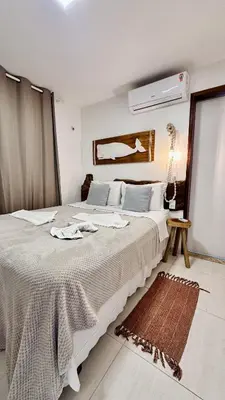 Uma cama ou camas num quarto em Apê Jardins